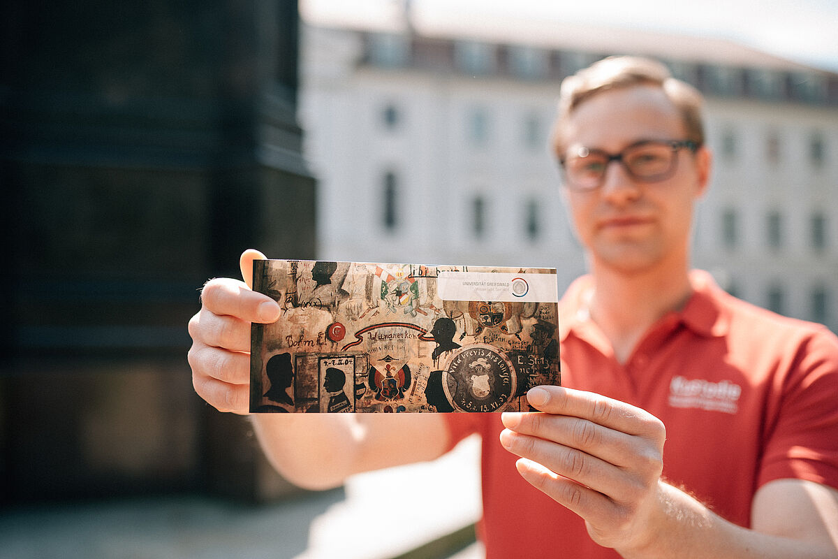 Tour guide displaying gift voucher